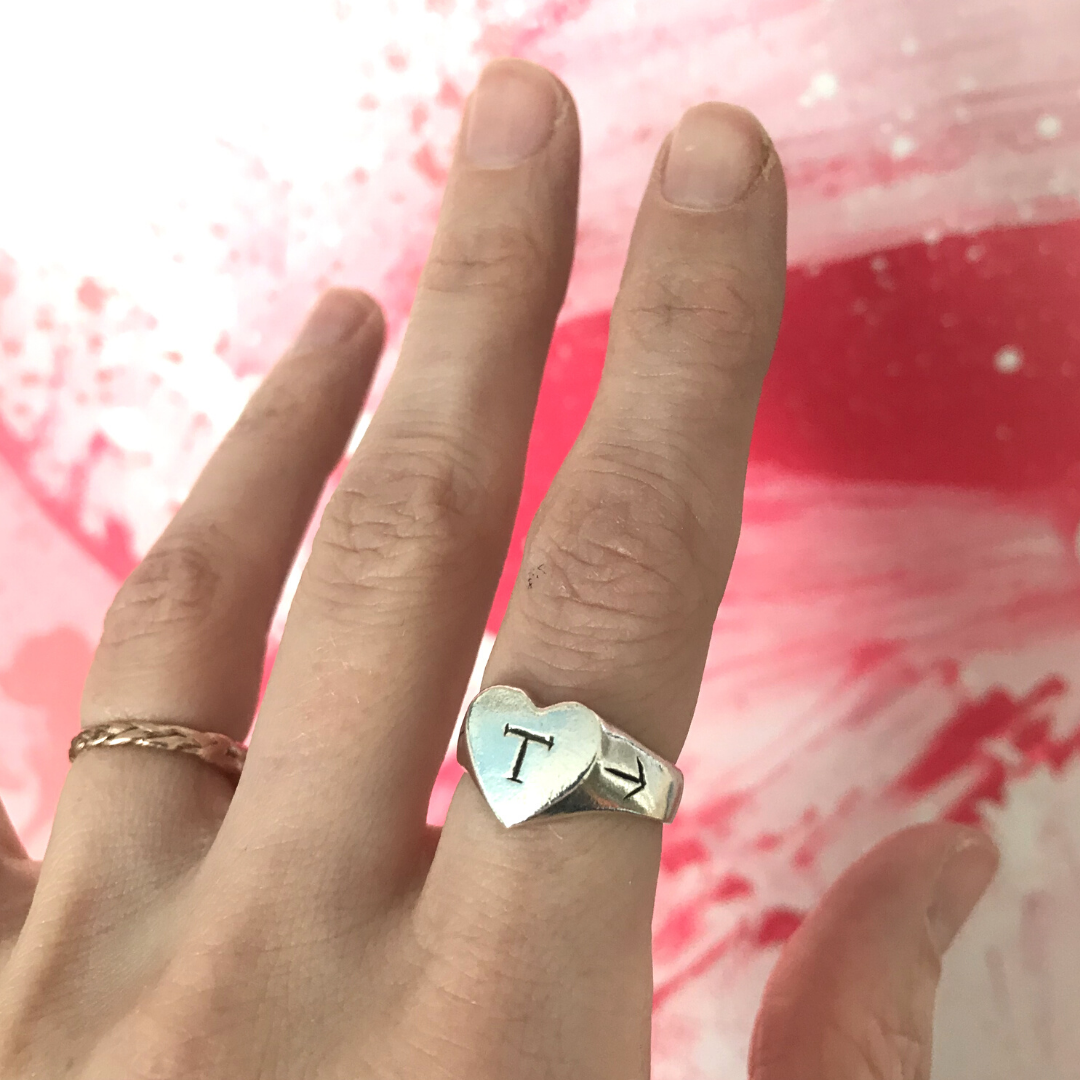 Silver heart-shaped signet ring with engraved initial