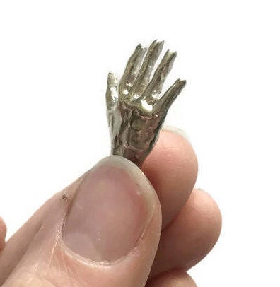 hand shaped silver body part  pendant